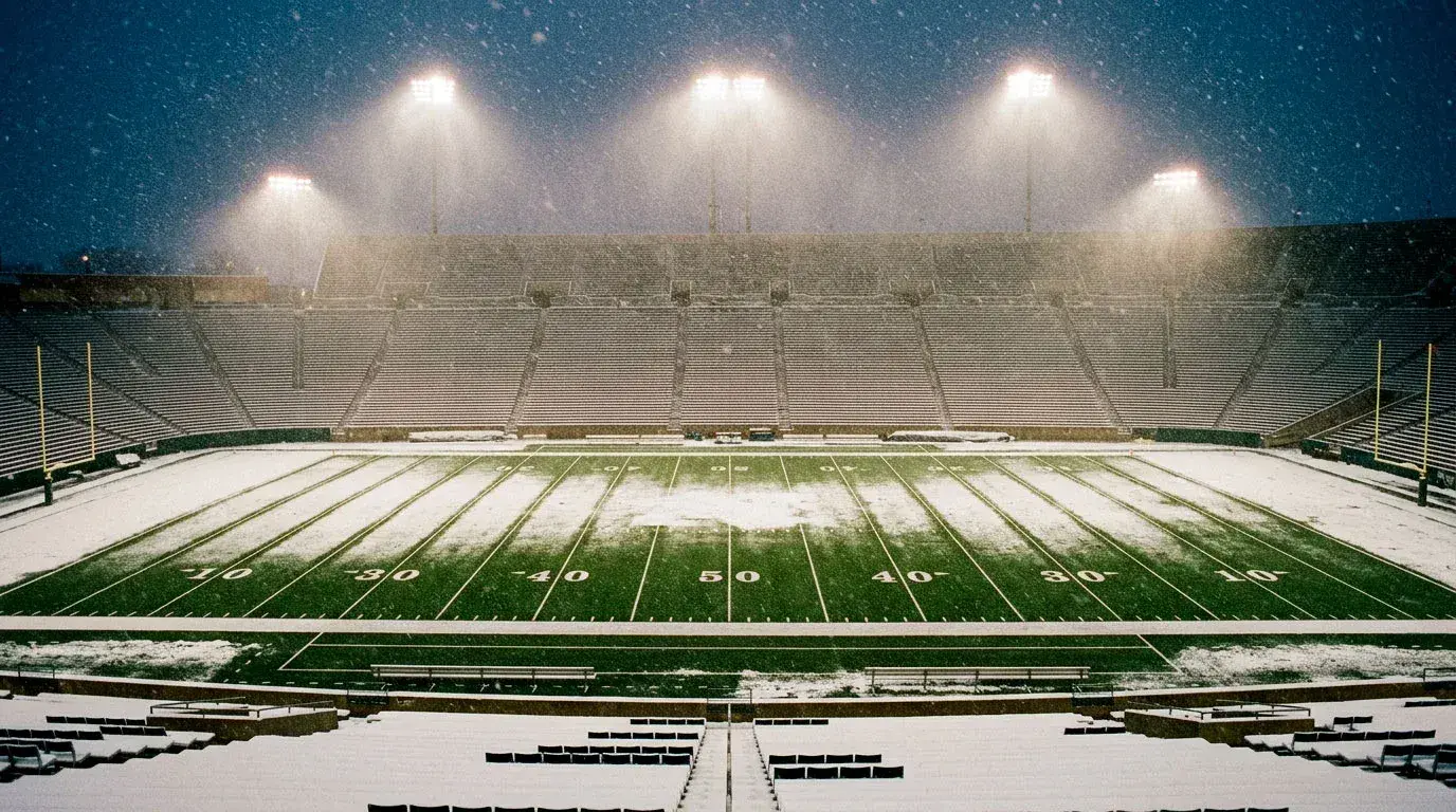 NFL outdoor stadium in heavy snow with weather conditions affecting game totals